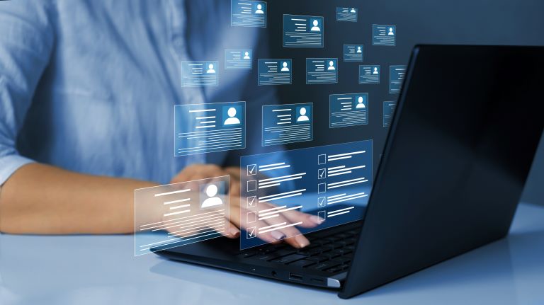 Hand typing code on a laptop | HR statistics